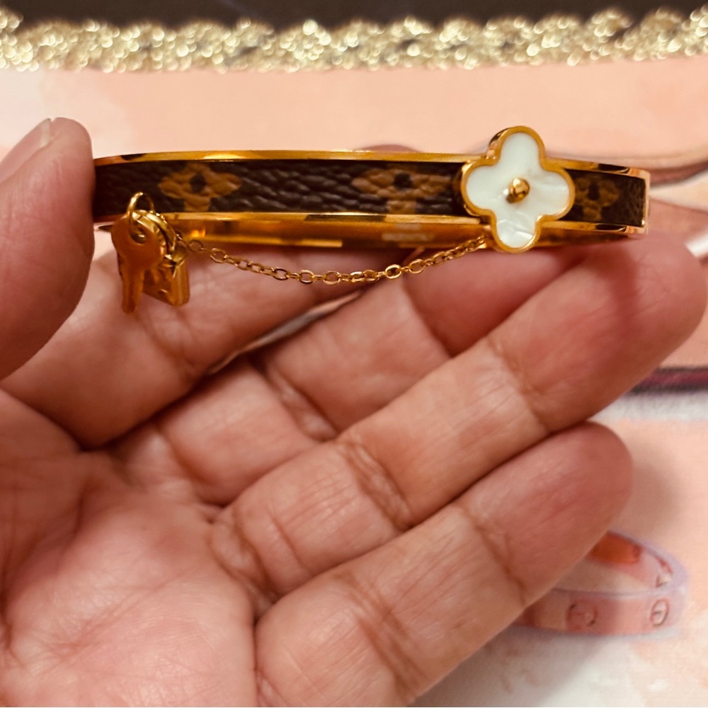 Louis Vuitton Gold-Tone Signature Engraved Bangle